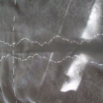 Inside, showing the lace attachment stitching